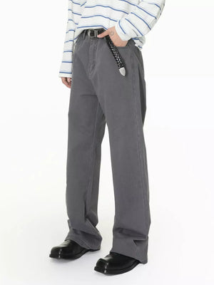 Men's relaxed fit grey cotton jeans with button closure and black belt.