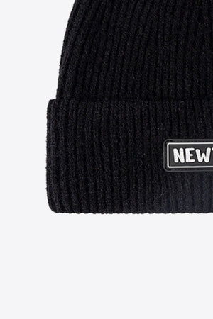 Black ribbed acrylic beanie with New York patch detail