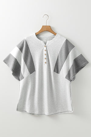 Gray colorblock waffle knit henley top with button detail and short sleeves.