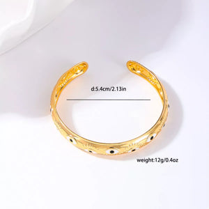 Golden evil eye bangle bracelet with 18K gold plating.