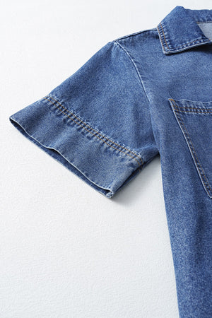 Light blue denim mini dress with short sleeves, collar, and chest pocket detail.