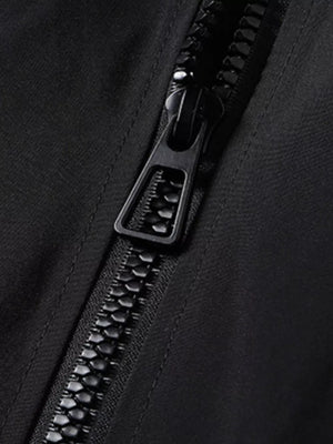 Black bomber jacket detail with a close-up of the black zipper.