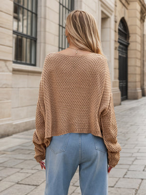 Camel acrylic cable knit cocoon sweater with a relaxed fit and wide sleeves.