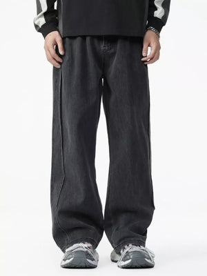 Men's dark wash cotton wide-leg jeans with elastic waist and contrast stitching.