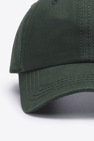 Green canvas baseball cap with stitched details on the brim and crown.