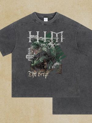 Dark gray acid wash graphic tee with "The Drip" text and distressed artwork.
