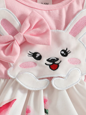 Pink baby dress with bunny applique, bow, and floral skirt.
