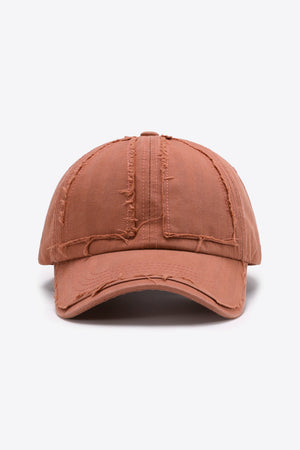 Burnt Coral raw edge denim baseball cap with distressed details