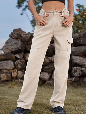 Tan denim cargo pants with elastic waist and utility pockets.