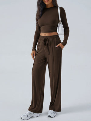 Ribbed knit crop top and wide leg pants set in coffee brown, with drawstring waist and side slits.