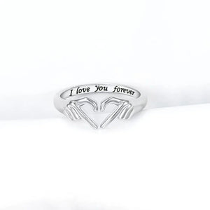 Silver ring with heart hands design and engraved text "I love You forever