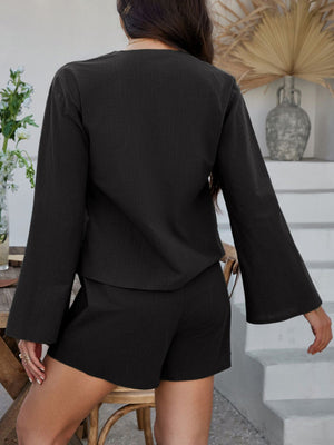 Black linen tie-front top with bell sleeves and matching shorts set
