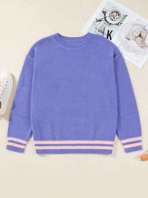 Plus size knit sweater in blue with pink striped cuffs and hem.