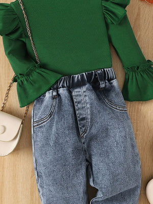 Dark green ribbed top with ruffle sleeves and blue denim jeans with elastic waistband.