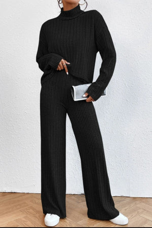 Black ribbed knit turtleneck lounge set with wide leg pants.