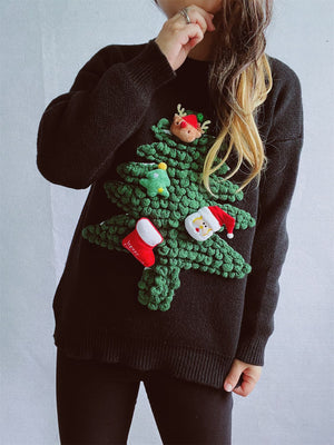 Black acrylic knit sweater with a 3D Christmas tree applique featuring Santa, a reindeer, a stocking, and a mini tree.