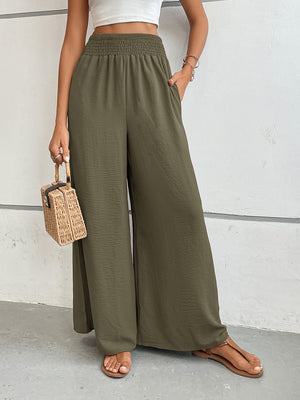 Moss green textured palazzo lounge trousers with smocked waist and wide leg.