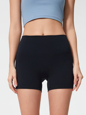 Black high-waisted activewear shorts with a seamless waistband and short inseam.