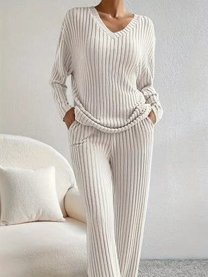 Ribbed knit loungewear set in off-white with V-neck top and pants.