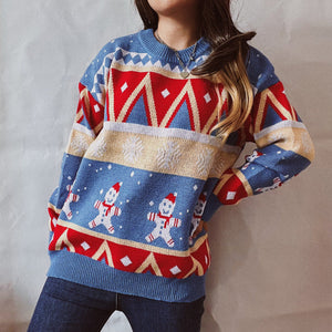 Festive Fair Isle knit jumper in blue with snowman and geometric pattern. Acrylic.