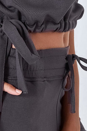 Dark gray drawstring shorts with pockets and tie details.