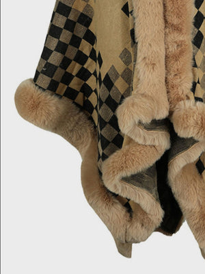 Checkered cape in tan and black acrylic with plush faux fur trim and pom-poms.