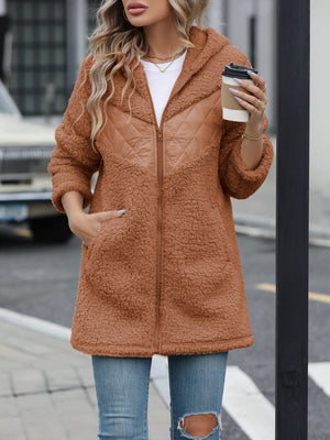 Caramel teddy hoodie with quilted panel detail and zipper closure.