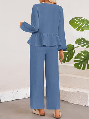 Dusty Blue textured peplum tie-neck co-ord set with wide leg pants and balloon sleeves.