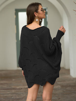 Black scalloped knit sweater with boat neck and balloon sleeves