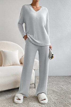 Light gray ribbed knit lounge set with v-neck top and wide-leg pants.