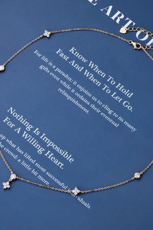Gold diamond cluster necklace with flower and round charms