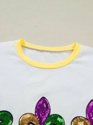 White cotton t-shirt with yellow trim and Mardi Gras sequin design.