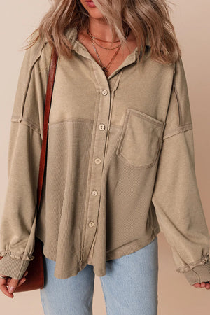 Tan waffle knit overshirt with button front and patch pocket.