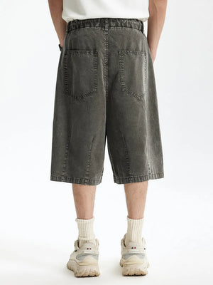 Men's dark gray cotton wide-leg chino shorts with back pockets.