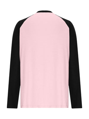 Blush pink long sleeve t-shirt with black raglan sleeves and round neck.