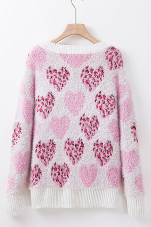 Fuzzy heart jacquard knit sweater in blush pink with leopard print hearts and pearl embellishments.