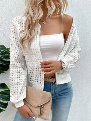 White textured mesh bomber jacket with a zip front and elastic cuffs.