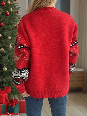 Red acrylic sweater with festive Fair Isle reindeer pattern on sleeves.