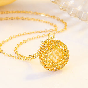 Gold plated sterling pendant necklace with a geometric cage ball design.