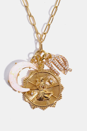 Gold pendant necklace with Virgo zodiac symbol, moon charm, and celestial disc.