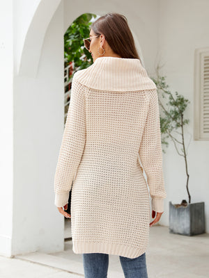 Cream waffle knit tunic with cowl neckline and long sleeves.
