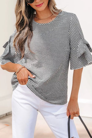 Gingham ruffled sleeve shirt in black and white polyester with a crew neck.