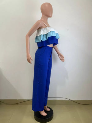 Chic layered ruffle crop top set with blue wide-leg pants.