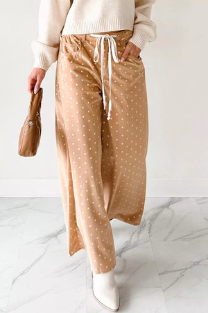 Polka dot drawstring wide-leg maternity trousers in tan with white dots.