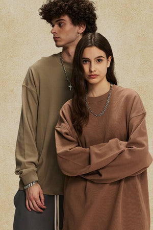 Oversized drop shoulder crewneck sweatshirt in brown, with relaxed fit and crew neckline.