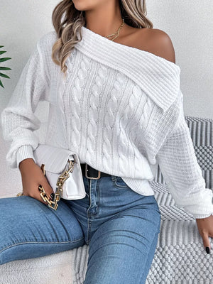 White cable knit sweater with off-shoulder neckline and long sleeves.