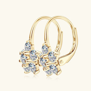 Gold celestial cluster huggie hoop earrings with clear cubic zirconia accents.