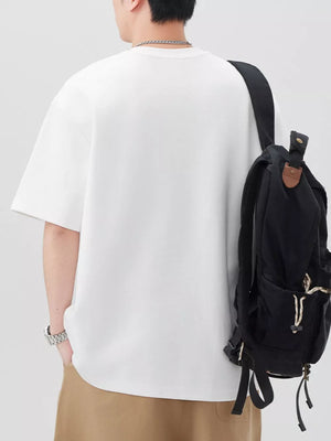 Oversized off-white cotton blend t-shirt with short sleeves and a crew neck.