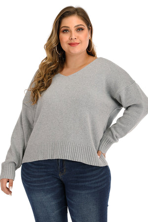Open back tie knit sweater in Cloudy Blue with V-neck and long sleeves.