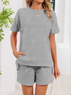 Gray relaxed two-piece set with crew neck t-shirt and shorts, featuring pockets.